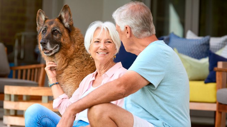 Senior couple with a large dog.